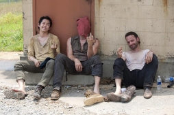 Steven Yeun (Glenn), Norman Reedus (Daryl) and Andrew Lincoln (Rick) having a break in the shade.